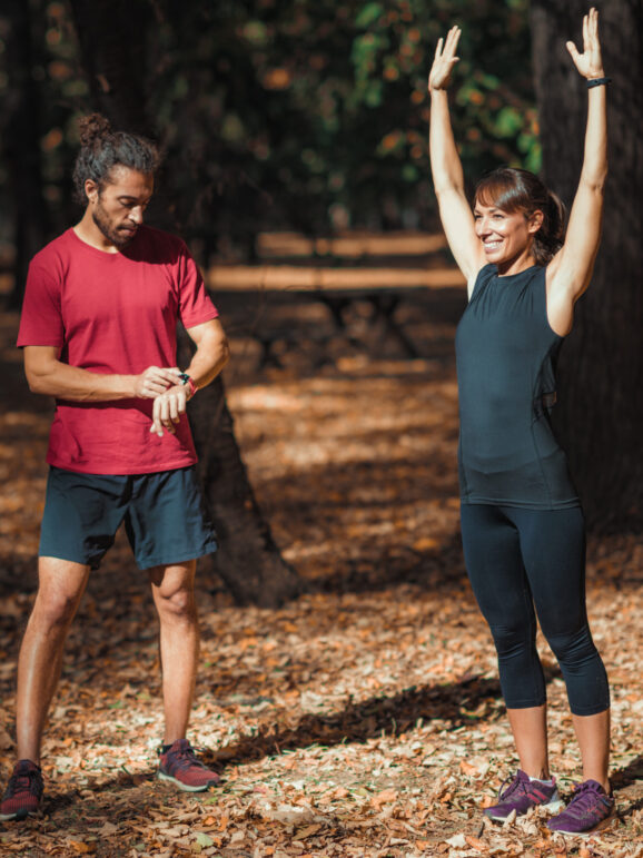 Young Couple stretching after training in the park