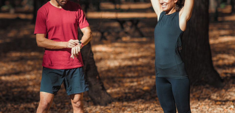 Young Couple stretching after training in the park